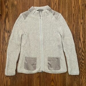 D. Exterior Sequined full zip sweater